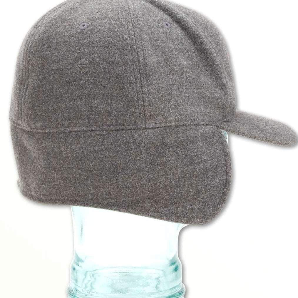 Volcom USA Winter Hat 2022 - A gray winter hat with a pom-pom on top and a faux fur trim around the edge of the brim.
