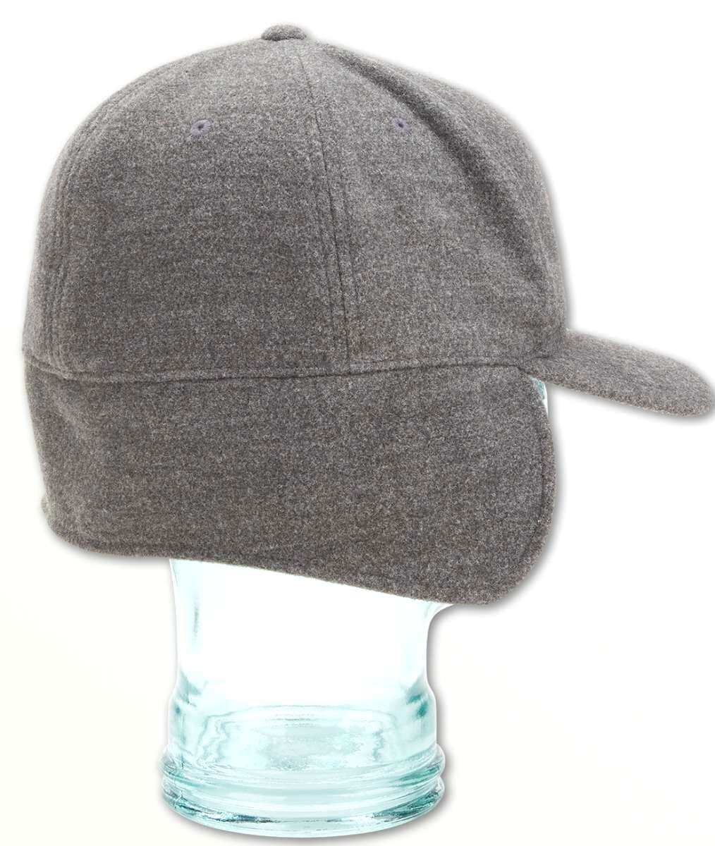 Volcom USA Winter Hat 2022 - A gray winter hat with a pom-pom on top and a faux fur trim around the edge of the brim.