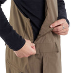 Volcom V.Co Sparta Bib Overall Pants 2024 - Khaki bib overalls with brown stitching and multiple pockets on front.