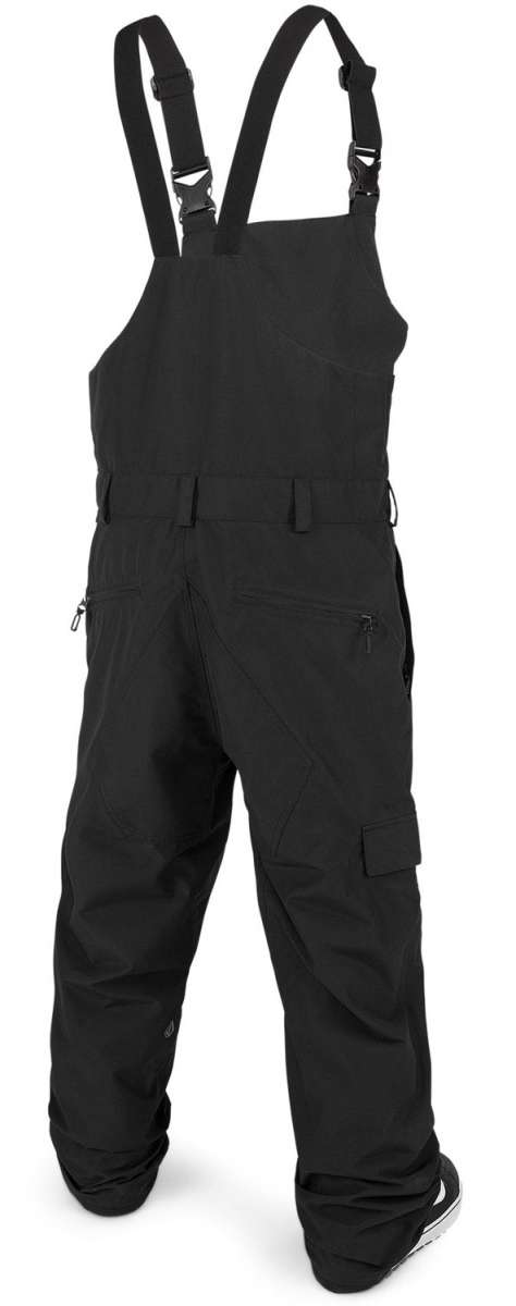 Volcom V.Co Sparta Bib Overall Pants 2024 - Black bib overalls with adjustable straps and multiple pockets, featuring a black-and-white striped pattern on the side of one leg.
