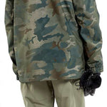 Volcom V.co Stretch Gore-Tex Jacket - A camouflage-printed jacket with a hood, featuring a zippered front and two side pockets.