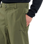 Volcom X Dustbox Pant 2024 - Olive green pants with a subtle pattern of darker olive stripes on the side seams.