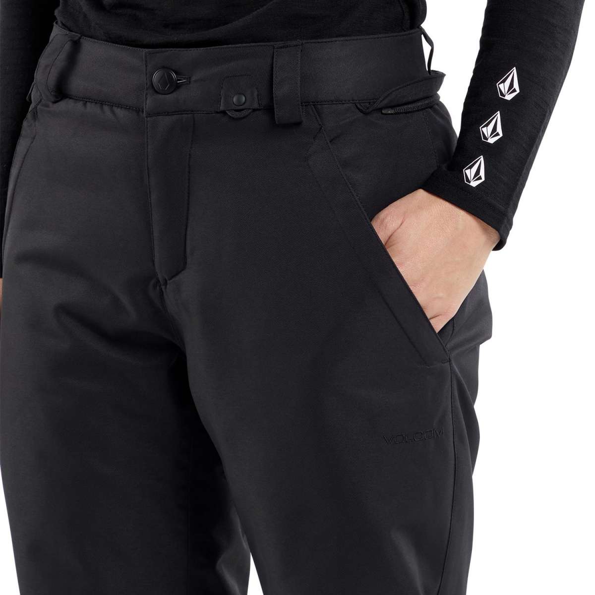 Volcom Women's Frochickie Insulated Pant 2024 - Black snow pants with a subtle white logo on the left thigh and a small black zipper pull on the right pocket.