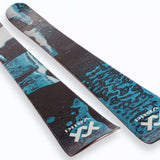 Volk Junior's Revolt 100 Ski 2023 - A black and white ski with a blue logo on the top of the binding area.
