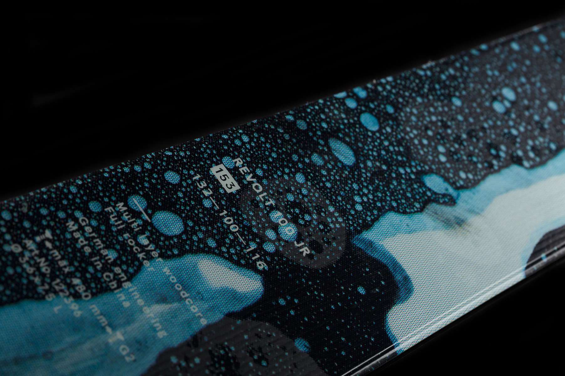 Volk Junior's Revolt 100 Ski 2023 - Black ski with white lettering and a blue logo on top.