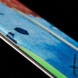 Volkl Revolt 90 Flat Ski 2022-2023 - A blue ski with a black and white checkered pattern on top, featuring a distinctive red stripe along its side.