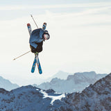 Volkl Revolt 90 Flat Ski 2022-2023 - A pair of blue skis with a white and red patterned design, featuring a distinctive "V" shape at the tip.