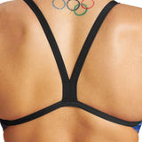 Arena Women's Puzzled Challenge Back One Piece Swimsuit - A blue and black one-piece swimsuit with a geometric pattern on the torso and back, featuring a high-cut leg design.