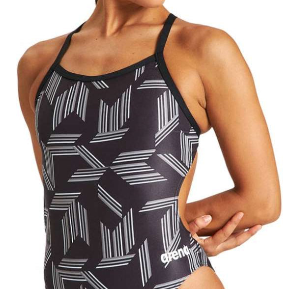 Arena Women's Puzzled Challenge Back One Piece Swimsuit - A black one-piece swimsuit with a geometric pattern of white lines and shapes resembling puzzles.