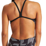 Arena Women's Puzzled Challenge Back One Piece Swimsuit - A black one-piece swimsuit with a geometric pattern of white lines and shapes on the torso, back, and hips.