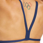 Arena Women's Puzzled Challenge Back One Piece Swimsuit - A navy blue one-piece swimsuit with a geometric pattern of light and dark blue shapes on the torso, featuring thin straps and a low back.