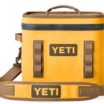 Yeti Hopper Flip 12 Personal Cooler - A yellow cooler with a handle on top and two side handles, featuring a zipper closure.