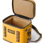 Yeti Hopper Flip 12 Personal Cooler - A yellow cooler with a zipper closure and two handles on either side, featuring an orange logo that reads "YETI" in bold letters.