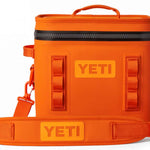 Yeti Hopper Flip 12 Personal Cooler - A small, rectangular cooler with a handle on top and an orange color.