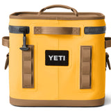 Yeti Hopper Flip 12 Personal Cooler - A yellow cooler with a handle on top and an orange logo that says "YETI" in bold letters.
