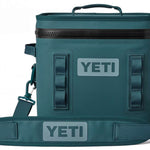 Yeti Hopper Flip 12 Personal Cooler - A dark gray cooler with a handle on top and an adjustable shoulder strap attached to its side.