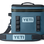 Yeti Hopper Flip 12 Personal Cooler - A blue cooler with a zipper closure and two handles on top, featuring an "YETI" logo in white letters on one side.
