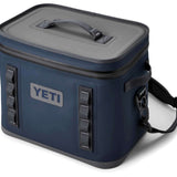 Yeti Hopper Flip 18 Personal Cooler - A navy blue cooler with a zippered lid and two handles on top, featuring a rectangular shape and a small logo on the front.