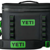 Yeti Hopper Flip 18 Personal Cooler - A black cooler with a zipper closure and green accents on the handle and logo.
