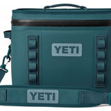 Yeti Hopper Flip 18 Personal Cooler - A dark gray cooler with a zippered lid and two handles on top, featuring a large logo in the center of the front.