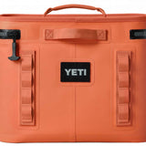 Yeti Hopper Flip 18 Personal Cooler - A coral-colored cooler with a handle on top and an orange zipper pull.