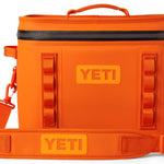 Yeti Hopper Flip 18 Personal Cooler - A cooler with a dark gray lid and a light gray body, featuring a handle on top and an orange logo.
