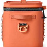 Yeti Hopper Flip 18 Personal Cooler - A coral-colored cooler with a zippered top and handle on top, featuring an orange logo on the front.