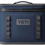 Yeti Hopper Flip 18 Personal Cooler - A navy blue cooler with a zippered lid and two handles on either side, featuring a prominent "YETI" logo in white letters on one side.