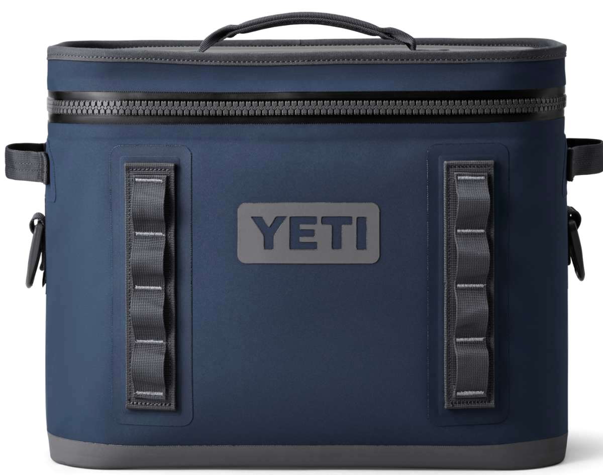 Yeti Hopper Flip 18 Personal Cooler - A navy blue cooler with a zippered lid and two handles on either side, featuring a prominent "YETI" logo in white letters on one side.