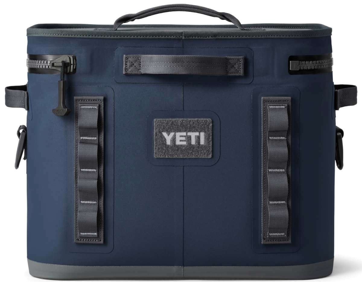 Yeti Hopper Flip 18 Personal Cooler - A navy blue cooler with a handle on top and an orange logo on one side.