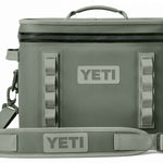 Yeti Hopper Flip 18 Personal Cooler - A dark gray cooler with a zippered top and two handles, one on each side.