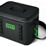 Yeti Hopper Flip 18 Personal Cooler - A black cooler with a zipper closure and two handles on top, featuring a green logo that says "YETI" in bold letters.