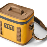 Yeti Hopper Flip 8 Personal Cooler - A yellow cooler with a handle on top and an orange zipper.