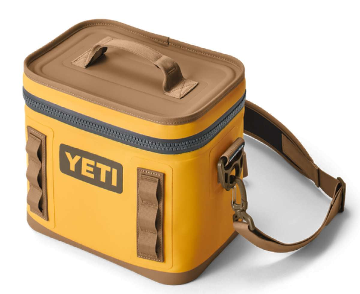 Yeti Hopper Flip 8 Personal Cooler - A yellow cooler with a handle on top and an orange zipper.