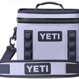 Yeti Hopper Flip 8 Personal Cooler - A gray cooler with a zipper closure and two handles, one on top and one on the side.