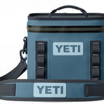 Yeti Hopper Flip 8 Personal Cooler - A blue cooler with a zipper closure and two handles on either side, featuring an "YETI" logo in white letters on one side.