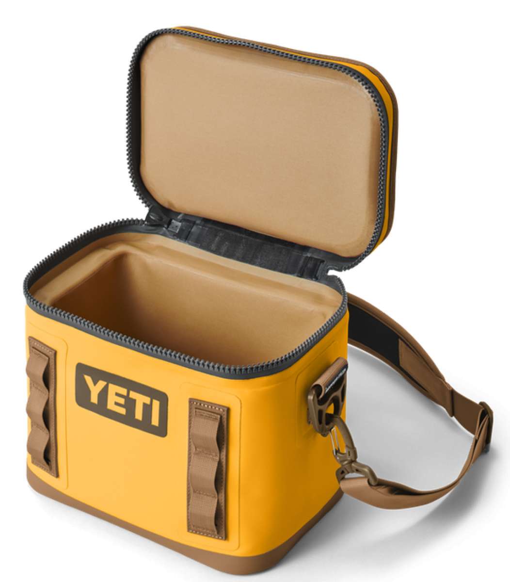 Yeti Hopper Flip 8 Personal Cooler - A yellow cooler with a handle and zipper closure on top, featuring an orange logo on one side.