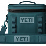 Yeti Hopper Flip 8 Personal Cooler - A dark gray cooler with a zippered top and two handles, one on each side.