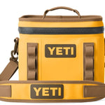 Yeti Hopper Flip 8 Personal Cooler - A yellow cooler with a handle on top and two adjustable shoulder straps attached to the sides.