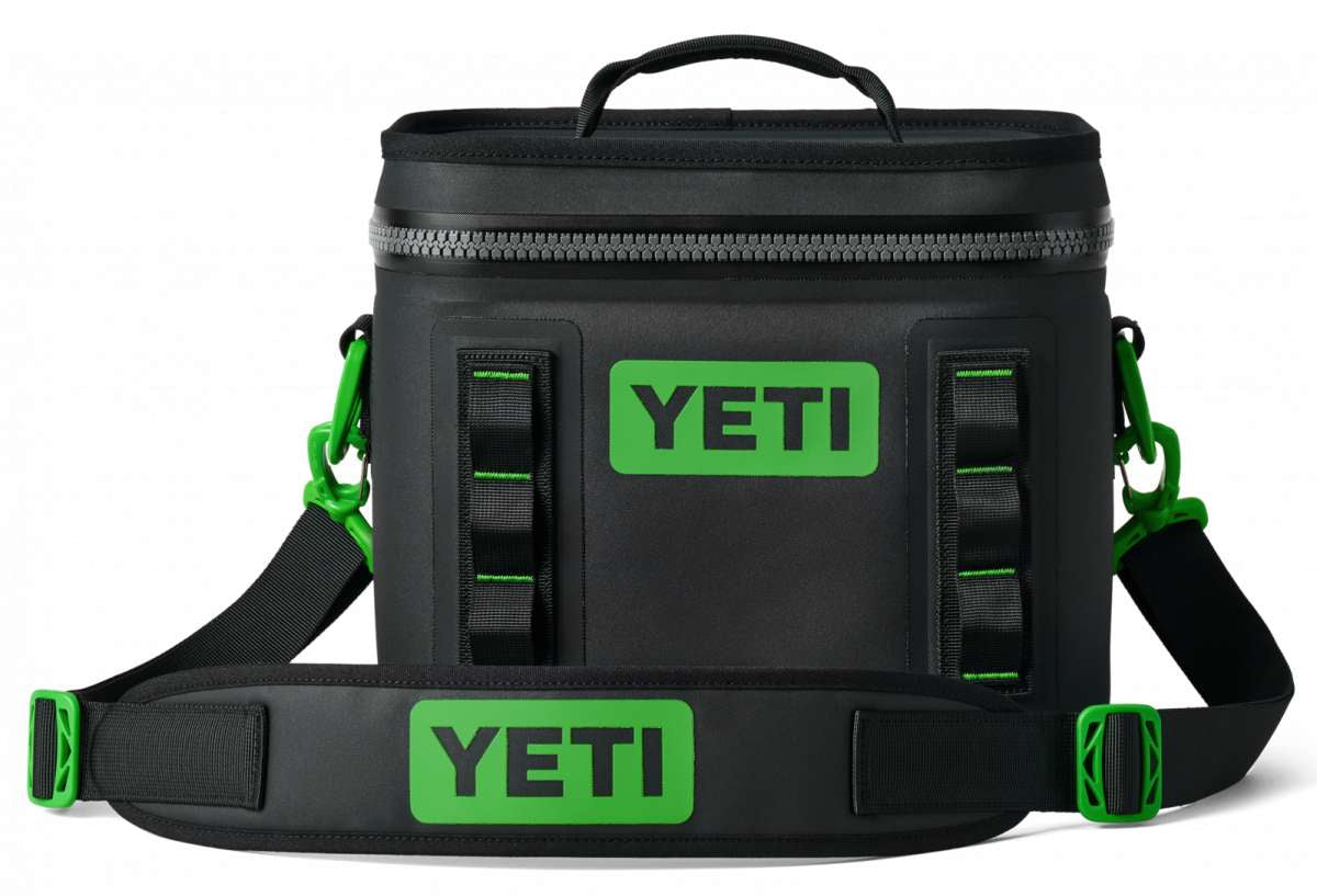Yeti Hopper Flip 8 Personal Cooler - A black cooler with a zipper closure and green accents on the handle and carabiner clip.
