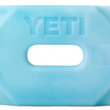Yeti Ice - 2lb - A light blue rectangular bag with a black cap on the left side, featuring embossed letters "YETI" at the top and an oval cutout in the middle.
