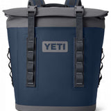 Yeti Hopper M12 Backpack Soft Cooler - A navy blue cooler with a gray zipper and handle, featuring a large main compartment and two smaller side pockets.