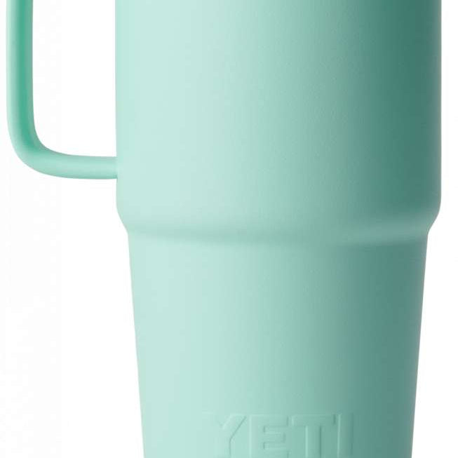 Yeti Rambler 20 oz. Travel Mug - A stainless steel travel mug with a clear lid and handle on the left side.