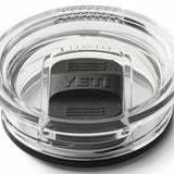 Yeti Rambler 20 oz. Travel Mug - A clear plastic travel mug with a black lid and embossed "YETI" logo on top.
