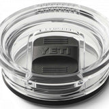 Yeti Rambler 20 oz. Travel Mug - A clear plastic travel mug with a black lid and embossed "YETI" logo on top.