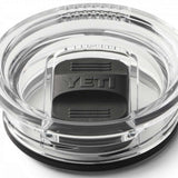 Yeti Rambler 20 oz. Travel Mug - A clear plastic travel mug with a black lid and embossed "YETI" logo on top.