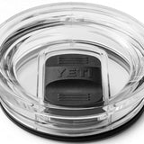 Yeti Rambler 30 oz. Travel Mug - A clear plastic travel mug with a black lid and handle, featuring a textured pattern on the body.