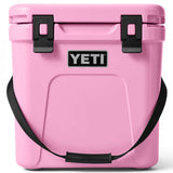 Yeti Roadie 24 Hard Cooler - A pink cooler with a black handle on top and a silver latch in front.
