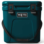 Yeti Roadie 24 Hard Cooler - A compact, portable cooler with a stainless steel handle and rubberized grip on top.
