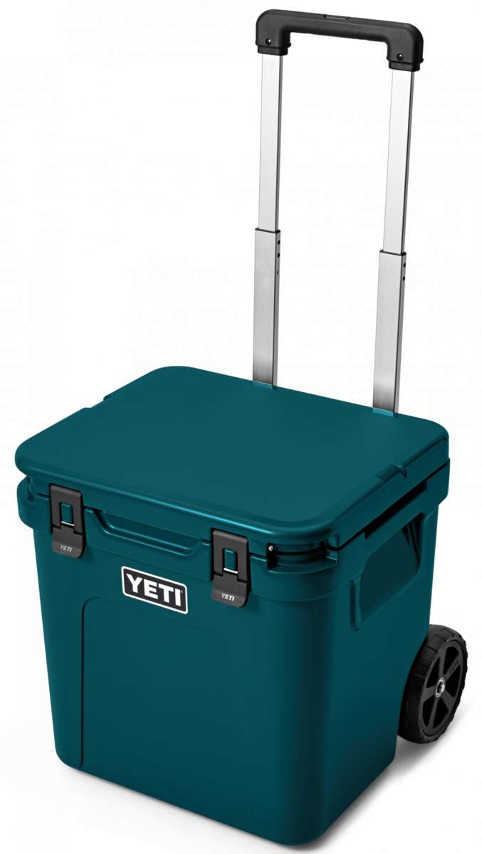 Yeti Roadie 48 Wheeled Cooler - A compact, wheeled cooler with a dark gray lid and handle, featuring a small white logo on the front that reads "YETI" in bold letters.